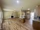 Spacious living room with a fireplace, ceiling fan, and an open floor plan to the kitchen at 437 Earnest Way, Kenly, NC 27542