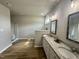 Bright main bathroom featuring double sinks, large mirrors, and a separate shower area at 437 Earnest Way, Kenly, NC 27542