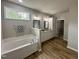 Beautiful main bathroom featuring double sinks, a tub, and walk-in closet access at 437 Earnest Way, Kenly, NC 27542
