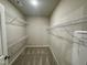 Walk-in closet featuring wire shelving, carpeted floors, and neutral paint at 437 Earnest Way, Kenly, NC 27542