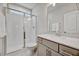 Modern bathroom with a glass-enclosed shower, quartz countertop, and brushed nickel fixtures at 4408 Walker Hallow St, Raleigh, NC 27616