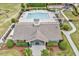 Aerial view of the community pool and recreation area, featuring a pool house, playground, and seating at 4408 Walker Hallow St, Raleigh, NC 27616