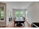 Spacious dining room filled with natural light, featuring hardwood floors and large windows at 4408 Walker Hallow St, Raleigh, NC 27616