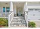 Welcoming front entrance with stone steps, a covered porch, and white railing at 4408 Walker Hallow St, Raleigh, NC 27616