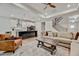 Open-concept living room with a kitchen view, recessed lighting, and stylish décor at 4408 Walker Hallow St, Raleigh, NC 27616