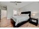 Inviting main bedroom featuring wood floors, a ceiling fan, and neutral paint at 4408 Walker Hallow St, Raleigh, NC 27616