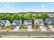 Street view of attractive two-story homes with well-manicured lawns and tree-lined street at 4408 Walker Hallow St, Raleigh, NC 27616