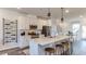 Bright kitchen with a spacious island with seating, stainless steel appliances, and stylish decor at 444 Deercroft Dr, Apex, NC 27539