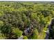 Aerial view of a home with mature trees and lush landscaping at 4533 Wood Valley Dr, Raleigh, NC 27613