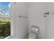 Powder room featuring tile flooring, toilet, and natural light from the window at 4533 Wood Valley Dr, Raleigh, NC 27613