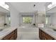 Bright bathroom features a large soaking tub, double sinks, and a separate shower at 4533 Wood Valley Dr, Raleigh, NC 27613