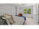 Bedroom with carpeted floors, white walls, and an exterior window at 4533 Wood Valley Dr, Raleigh, NC 27613