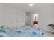Carpeted bedroom with access to bathroom and walk-in closet at 4533 Wood Valley Dr, Raleigh, NC 27613