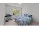 Bedroom featuring carpet, a window with natural light, and blue bedding at 4533 Wood Valley Dr, Raleigh, NC 27613