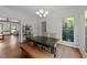 Bright dining room with modern chandelier and bench seating at 4533 Wood Valley Dr, Raleigh, NC 27613