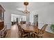 Elegant dining room with chandelier and classic wood furniture at 4533 Wood Valley Dr, Raleigh, NC 27613