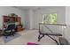 Spacious flex room featuring a workout bench, desk area, and carpeted floor at 4533 Wood Valley Dr, Raleigh, NC 27613