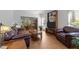 Open-concept living room with dining area and abundant natural light at 4533 Wood Valley Dr, Raleigh, NC 27613