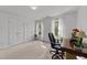 Bright office space with dual windows, white walls, and three storage closets at 4533 Wood Valley Dr, Raleigh, NC 27613