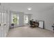 Sunlit office space with natural light, neutral walls, and carpeted floors at 4533 Wood Valley Dr, Raleigh, NC 27613