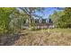 Charming home featuring a covered front porch, dormer windows, and a serene wooded setting at 5019 Dorsey Rd, Oxford, NC 27565