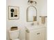 Modern bathroom with marble countertop, mirror, and updated lighting at 58 S Grace Way, Henderson, NC 27537