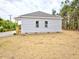 Exterior view of home with light gray siding and two windows at 58 S Grace Way, Henderson, NC 27537