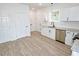 Modern kitchen with stainless steel appliances, granite countertops, and ample storage space at 58 S Grace Way, Henderson, NC 27537