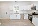 Updated kitchen featuring stainless steel appliances, granite countertops, and stylish fixtures at 58 S Grace Way, Henderson, NC 27537
