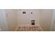 Laundry room with diamond pattern tile flooring and appliance hookups at 58 S Grace Way, Henderson, NC 27537
