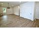 Spacious living room featuring hardwood floors and neutral walls, offering a flexible living space at 58 S Grace Way, Henderson, NC 27537