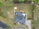 Birds-eye view of a home showing a large deck with dining area and landscaped backyard at 6024 Lunenburg Dr, Raleigh, NC 27603