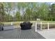 Covered grill on the back deck overlooking the beautiful lawn and tree line at 6024 Lunenburg Dr, Raleigh, NC 27603