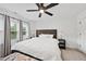 Relaxing bedroom featuring a king size bed, ceiling fan, and bedside lamps at 6024 Lunenburg Dr, Raleigh, NC 27603