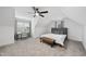 Spacious bedroom with angled ceiling, stylish desk, neutral carpet, and a comfortable seating bench at 6024 Lunenburg Dr, Raleigh, NC 27603