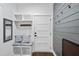 Stylish entryway featuring a bench with storage, hooks, and wood-look accent wall at 6024 Lunenburg Dr, Raleigh, NC 27603