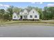 Beautiful two story modern farmhouse with lovely landscaping and a welcoming porch at 6024 Lunenburg Dr, Raleigh, NC 27603