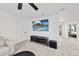 Basement room featuring a large wall mounted TV, a sound system, recessed lighting, and a comfortable sofa at 6024 Lunenburg Dr, Raleigh, NC 27603