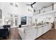 Inviting living area with hardwood floors, high ceilings, fireplace, and a view of the second-floor balcony at 6024 Lunenburg Dr, Raleigh, NC 27603