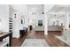 Spacious living room with high ceilings, hardwood floors, modern furniture, and large windows at 6024 Lunenburg Dr, Raleigh, NC 27603