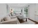Bright living room featuring a neutral color scheme, access to the deck, and lots of natural light at 6024 Lunenburg Dr, Raleigh, NC 27603