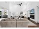 Spacious living room with a fireplace, soaring ceilings, and modern decor at 6024 Lunenburg Dr, Raleigh, NC 27603