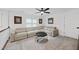 Loft featuring a large sectional, black ceiling fan, a patterned center table and neutral carpeting at 6024 Lunenburg Dr, Raleigh, NC 27603