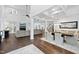 Open-concept living and dining area with hardwood floors, modern furnishings, and lots of natural light at 6024 Lunenburg Dr, Raleigh, NC 27603
