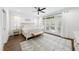 Spacious main bedroom with hardwood floors, a ceiling fan, and natural light at 6024 Lunenburg Dr, Raleigh, NC 27603