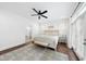 Bright main bedroom featuring hardwood floors, ensuite bathroom access, and lots of natural light at 6024 Lunenburg Dr, Raleigh, NC 27603