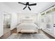 Bright main bedroom featuring hardwood floors, ensuite bathroom access, and lots of natural light at 6024 Lunenburg Dr, Raleigh, NC 27603