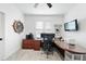 Inviting home office featuring a ceiling fan, a modern desk, nautical accents, and comfortable seating at 6024 Lunenburg Dr, Raleigh, NC 27603