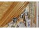 Unfinished attic space with exposed beams and insulation, great for extra storage at 604 Young Forest Dr, Wake Forest, NC 27587
