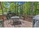 Wood back deck with patio table and seating, perfect for outdoor enjoyment at 604 Young Forest Dr, Wake Forest, NC 27587